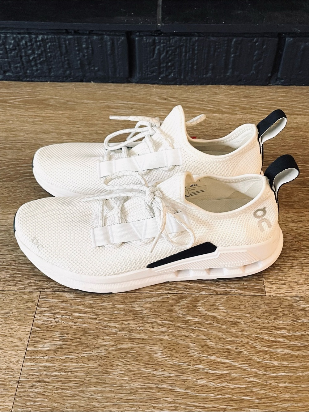 On Women’s Lightweight Running Sneakers in White with Black Accent